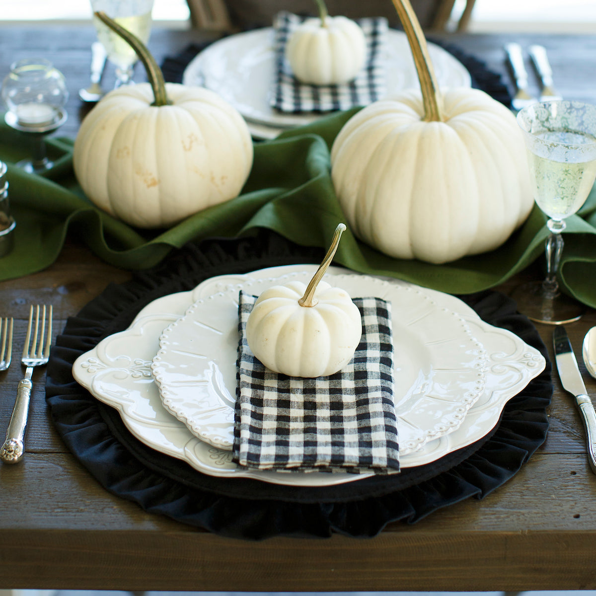 Arte Italica Bella Bianca scalloped charger platter Italian stoneware with white pumpkins on table