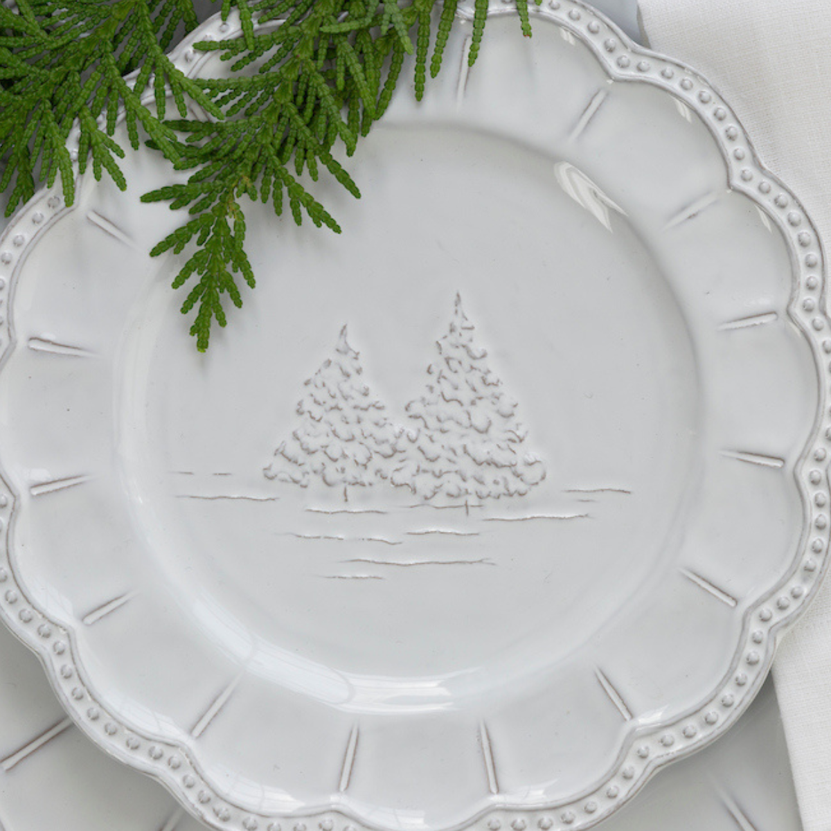 arte-italica-bella-natale-salad-dessert-plate-stoneware detail of winter trees on plate