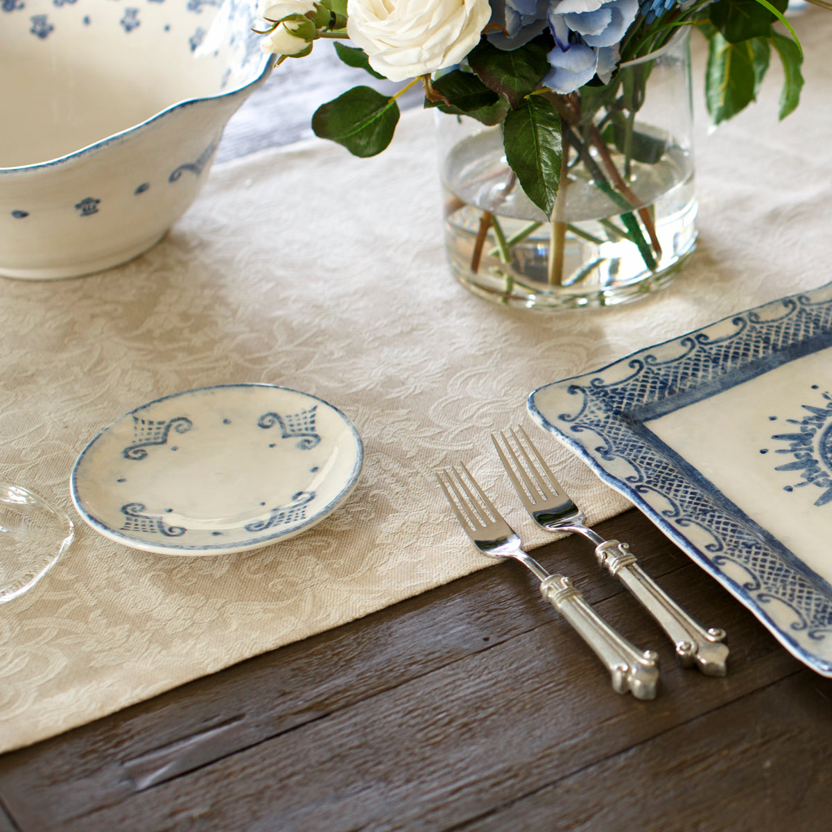 Arte Italica Burano bread and canapé plate blue ceramic Italian hand painted dinnerware, artisan tableware on table with plate