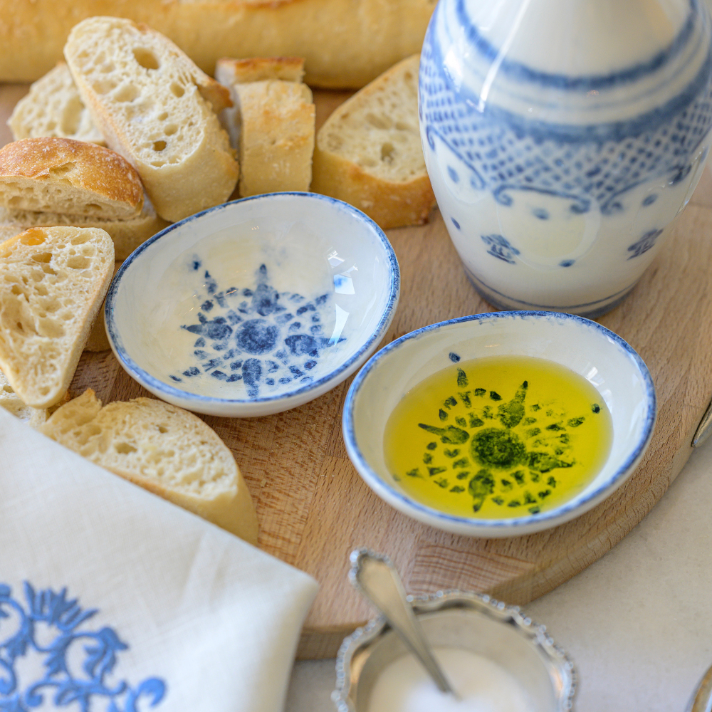 Arte Italica Burano dipping bowl set blue ceramic Italian hand painted dinnerware with oil and bread on table