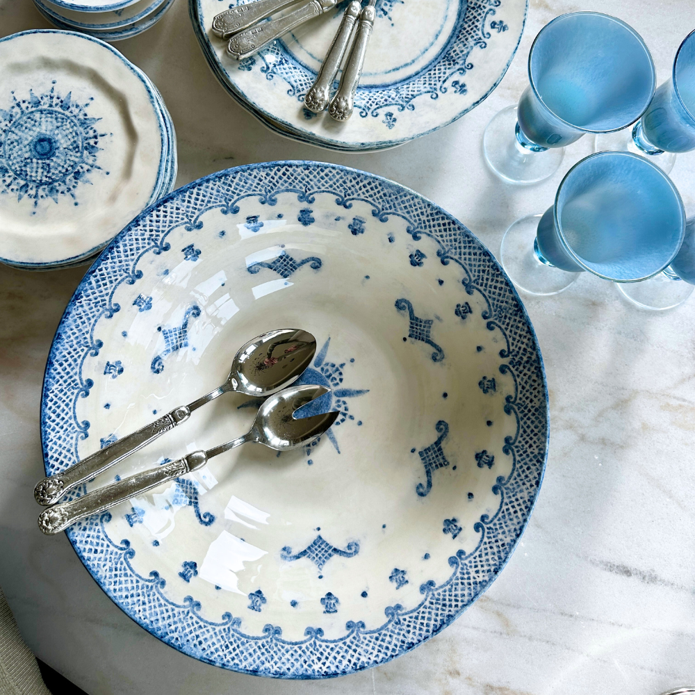 Arte Italica Burano pasta serving bowl blue ceramic Italian hand painted dinnerware with spoons overhead view