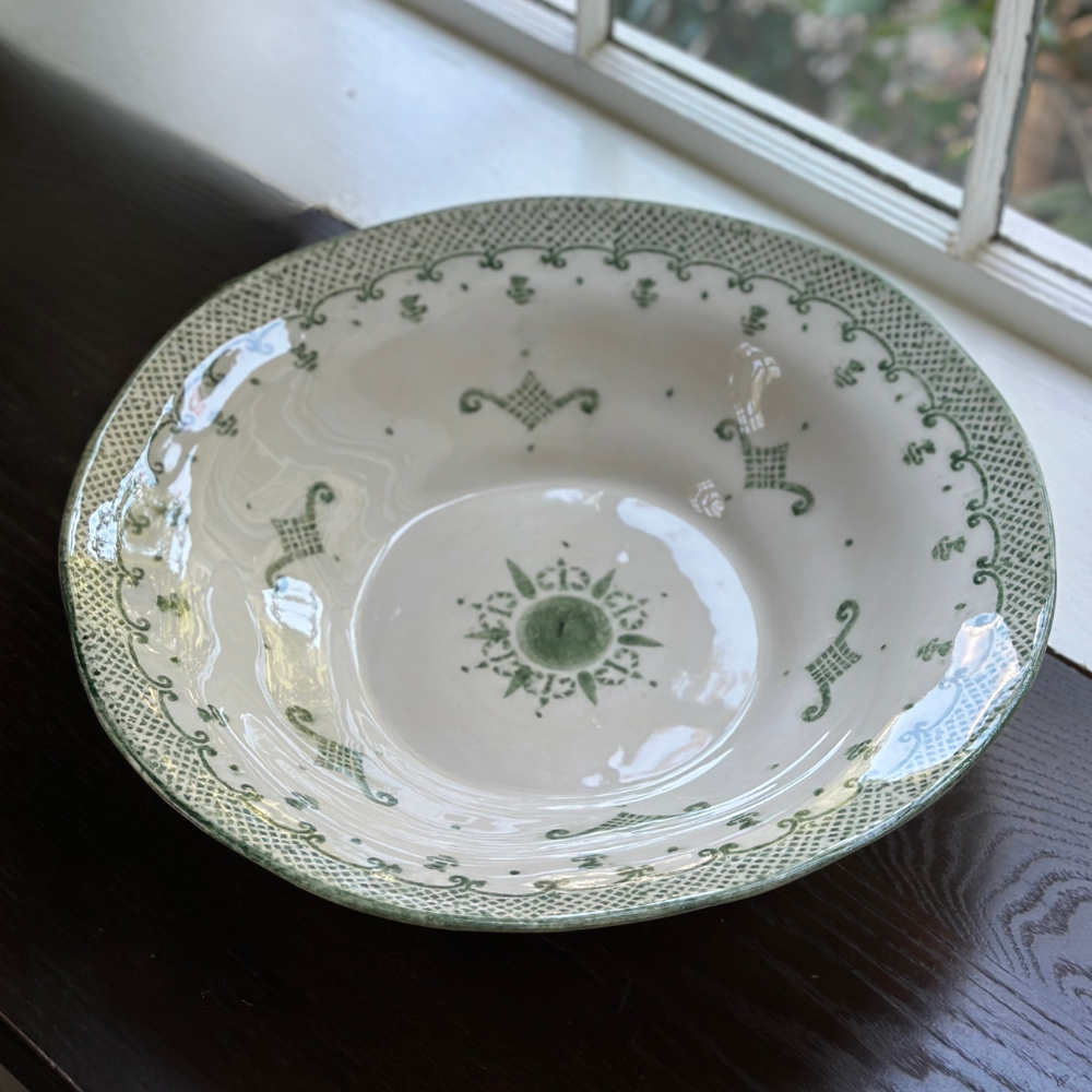 Arte Italica Burano pasta serving bowl green ceramic Italian hand painted dinnerware detail of bowl by window