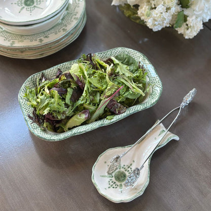 Arte Italica Burano rectangular dish green ceramic Italian hand painted dinnerware serving salad on table with spoon holder