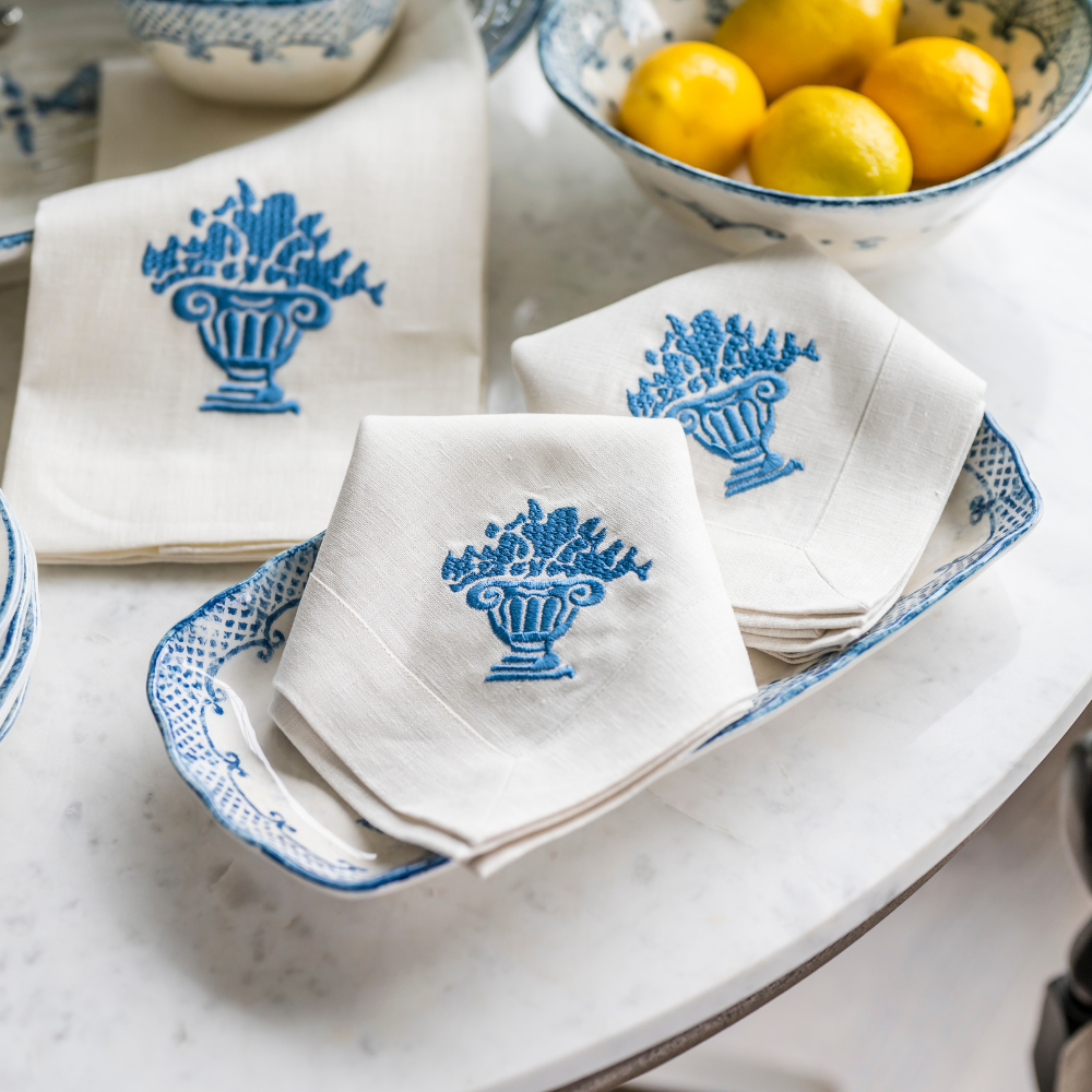 Arte Italica Burano rectangular tray blue ceramic Italian hand painted dinnerware with napkins displayed