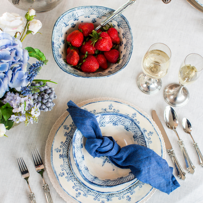 Arte Italica Burano small serving bowl blue ceramic Italian hand painted dinnerware with strawberries on table