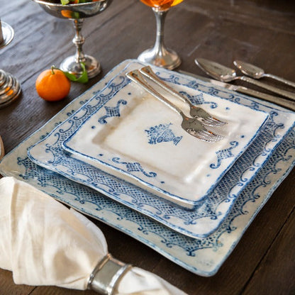 Arte Italica Burano square salad and dessert plate blue ceramic Italian hand painted dinnerware plate stack on wood table