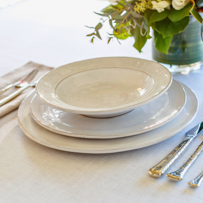 Firenze Pasta Soup Bowl white Italian stoneware handcrafted soup bowl side view with plate stack on table