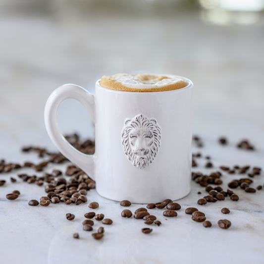 Arte Italica Renaissance Leone Mug White Handmade Italian Ceramic Lion Inspired Coffee Tea Mug in scattered coffee beans 