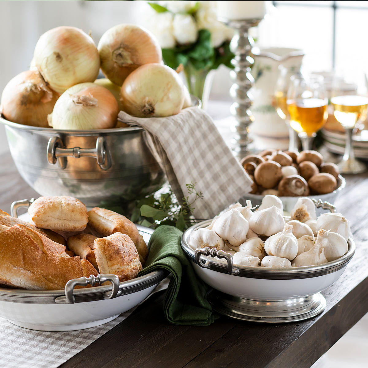 Large Tuscan footed bowl with handles in bianco white ceramic and pewter accents, ideal for serving pasta or salads.