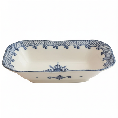 Rectangular ceramic dish with blue decorative patterns on a white background